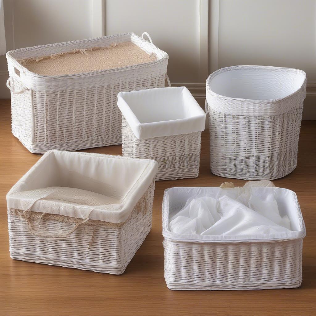 Various shapes and sizes of white wicker storage baskets.