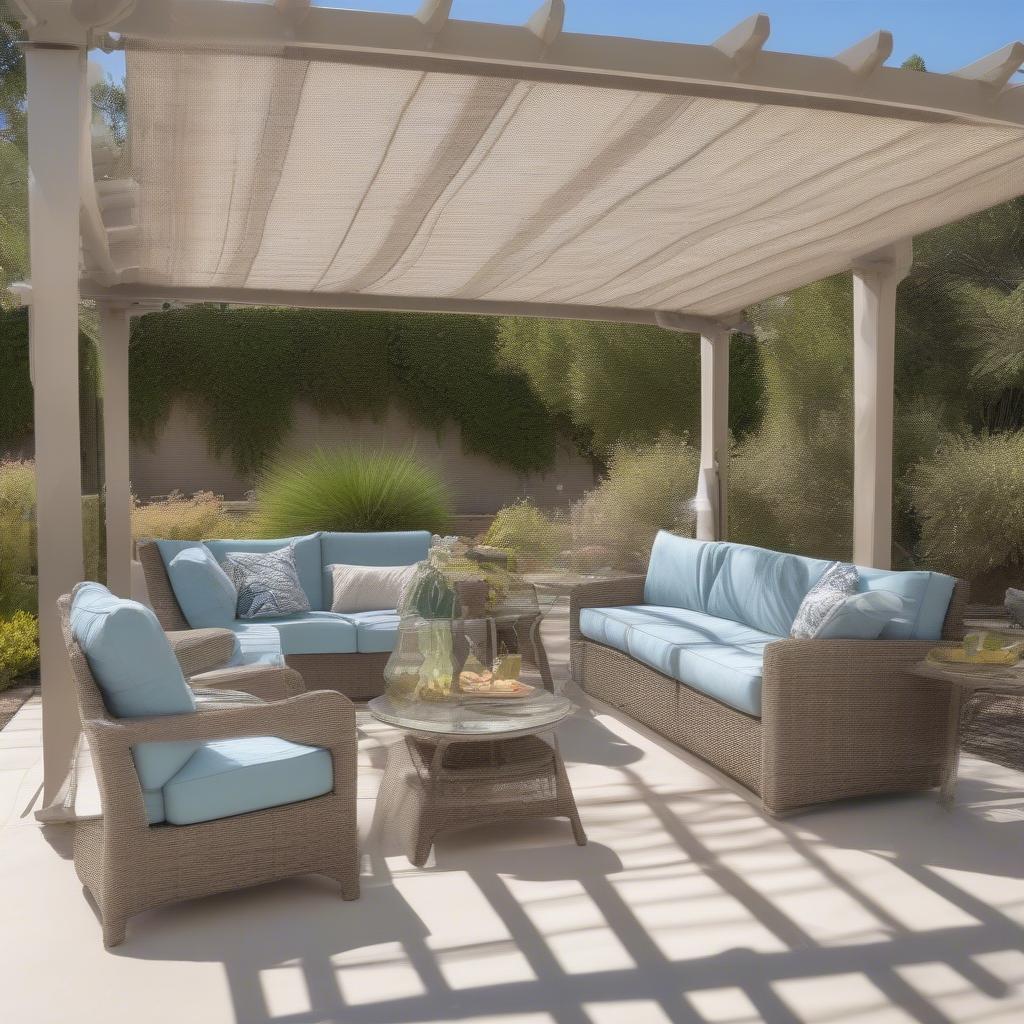 Resin wicker furniture protected by a patio cover in Arizona.