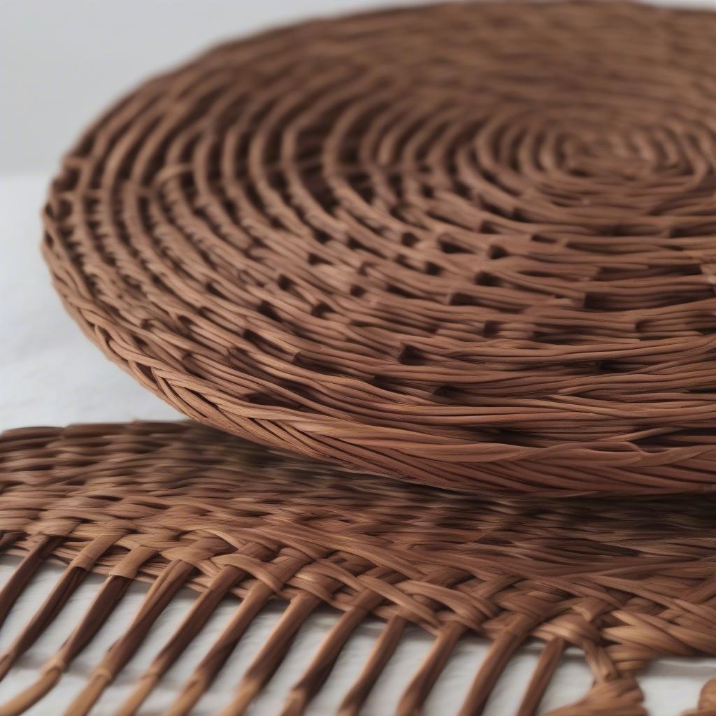 Set of Round Brown Wicker Mats in a 12-Inch Wicker Holder