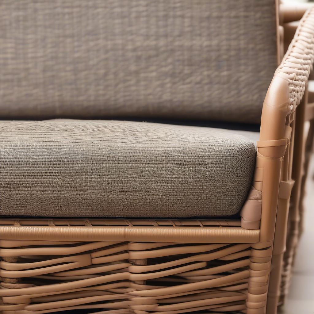 Close-up of wicker loveseat storage and cushions