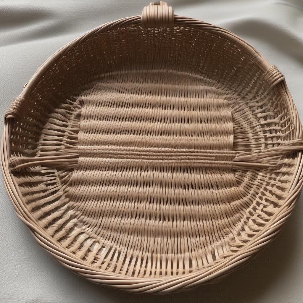 Wicker paper plate holder with a handle