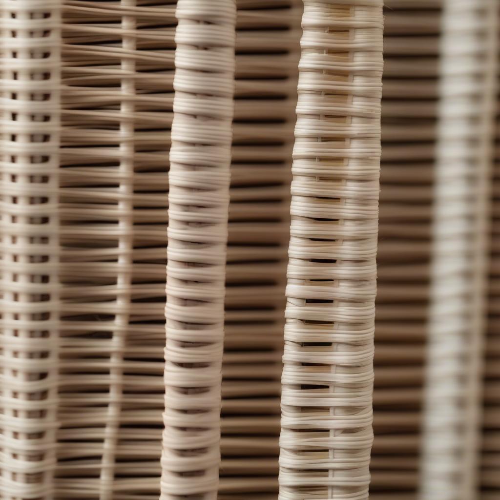 Close-up view of wicker roll up blinds showcasing different weaving patterns and materials, highlighting the varying levels of light filtration and privacy they offer.