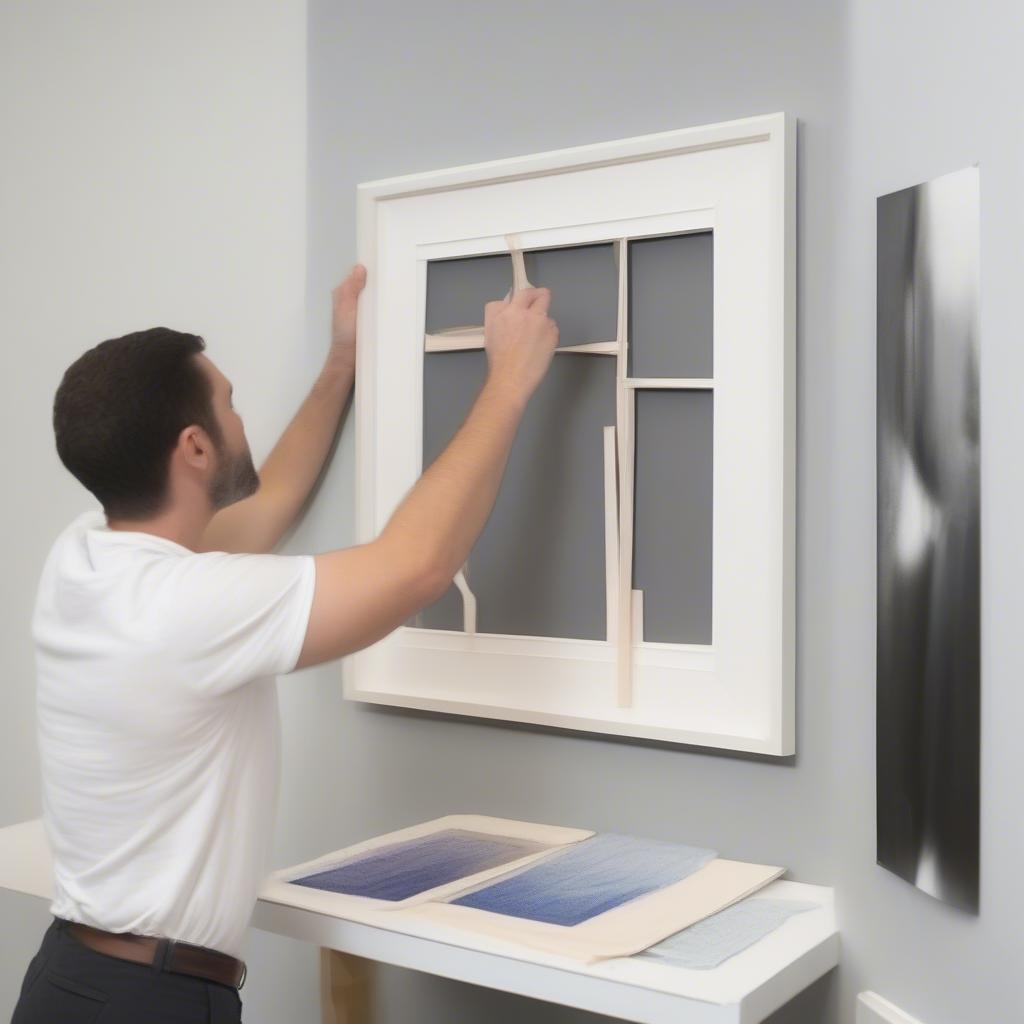 Step-by-step guide on applying heavy duty picture hanging strips to a picture frame.