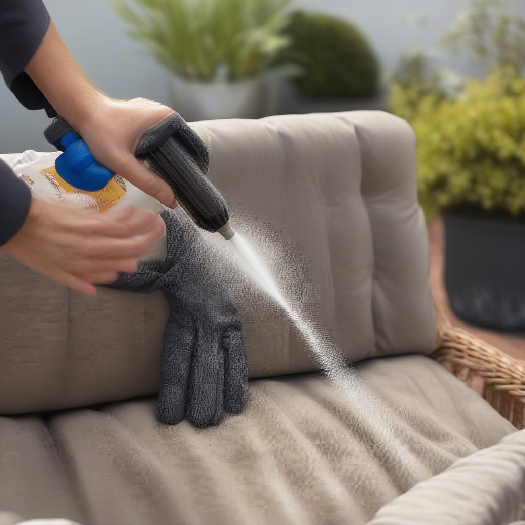 Applying sealant spray to wicker furniture in a well-ventilated outdoor area.