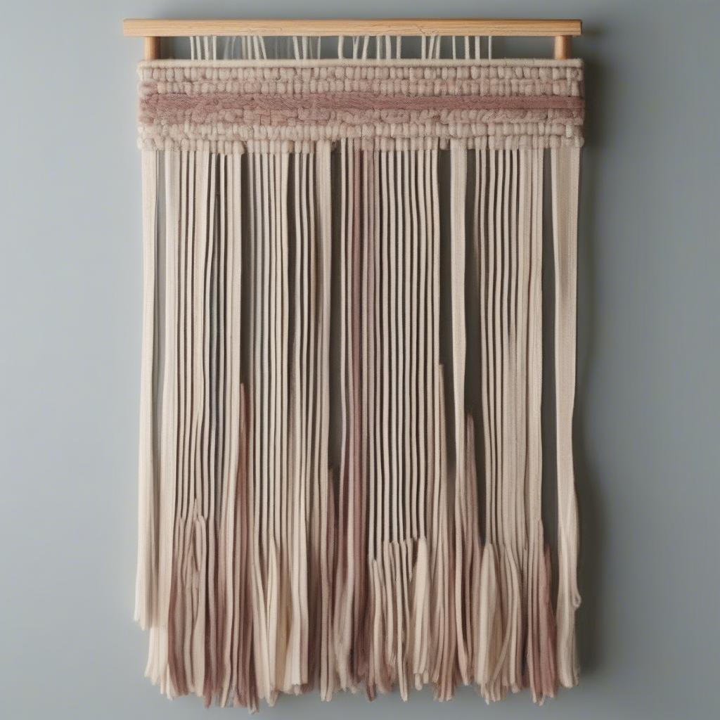 DIY woven wall art ideas using readily available materials like yarn, rope, and fabric scraps.