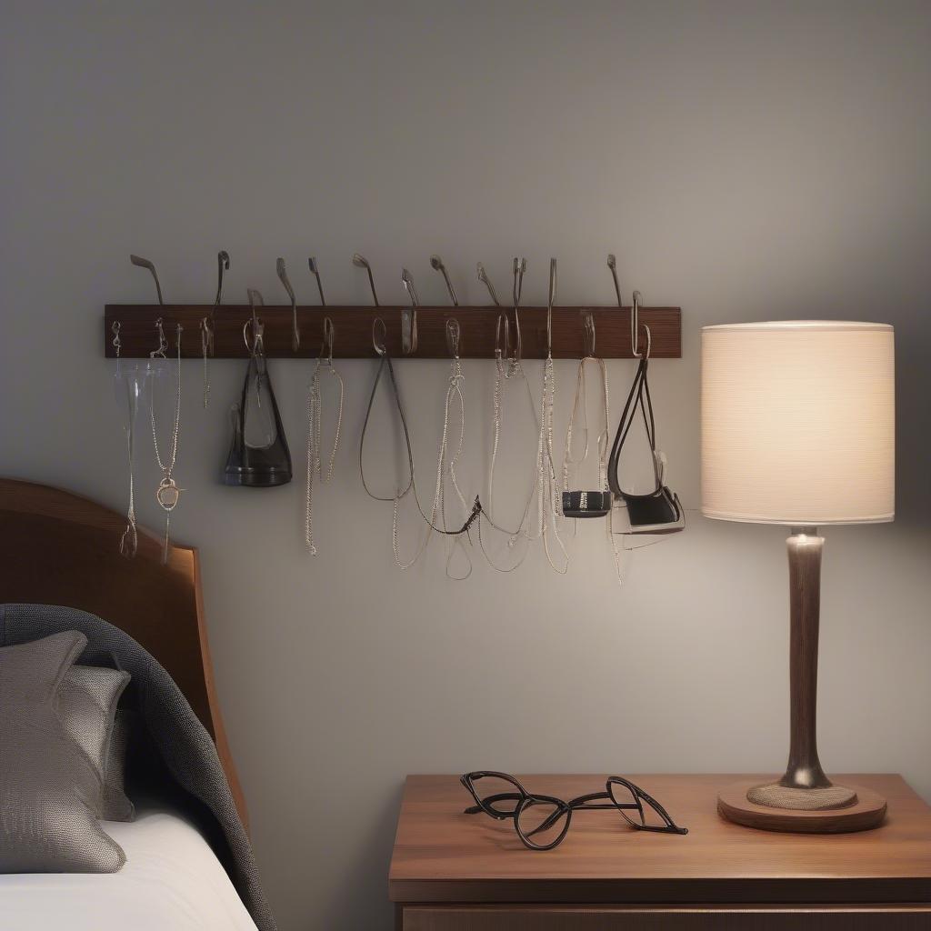 Glasses hooks neatly organizing multiple pairs of eyeglasses on a wooden nightstand.