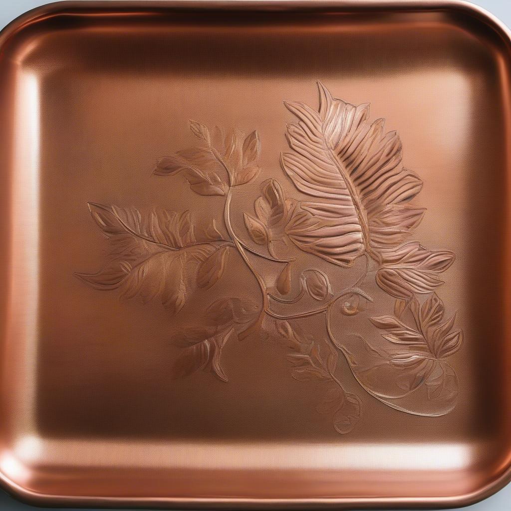 Intricate hammered copper tray with detailed design