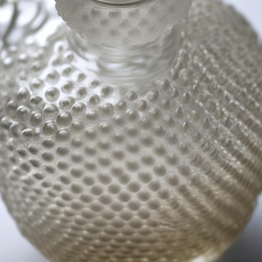 Close-up of a hobnail decanter showcasing the intricate detail of the hobnail pattern