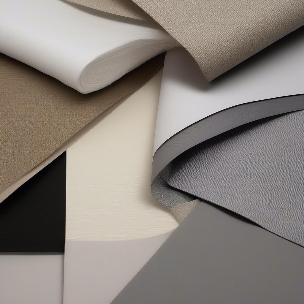 A close-up view of different mat colors and textures, including fabric, paper, and linen.