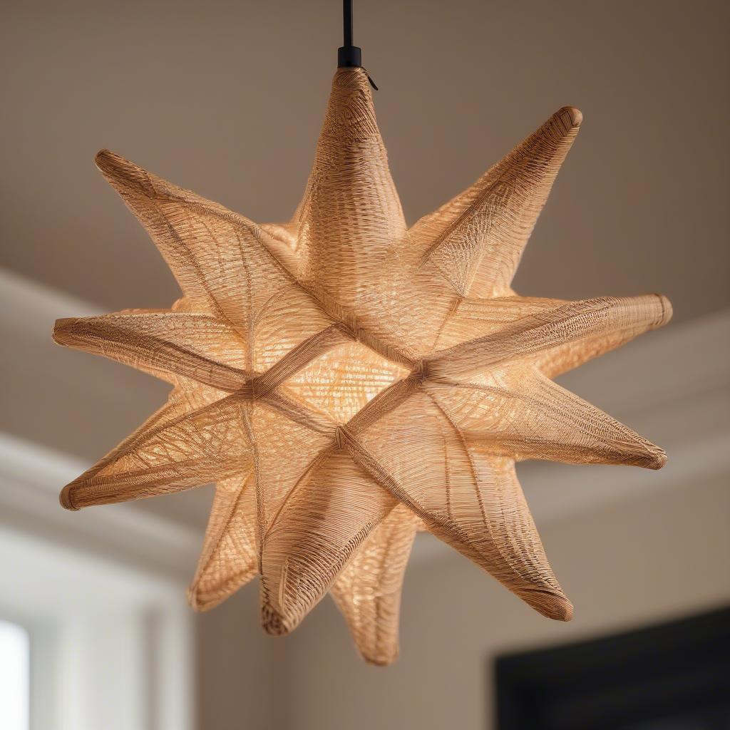 Northstar pendant made of wicker and rattan hanging in a brightly lit living room.