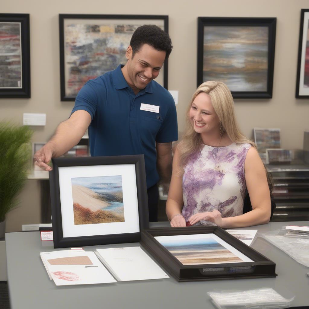 A customer discussing custom framing options with an Office Depot employee