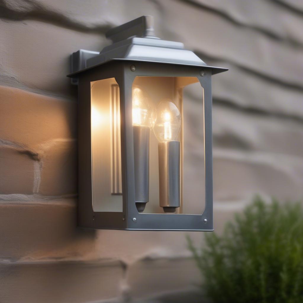 Outdoor galvanized wall sconce illuminating a patio