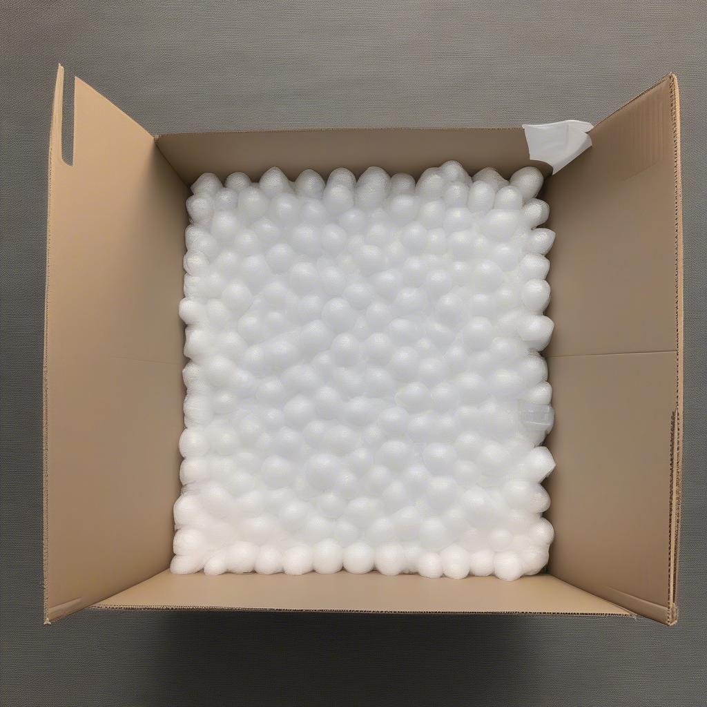 Packing an 11x14 Box with Protective Materials