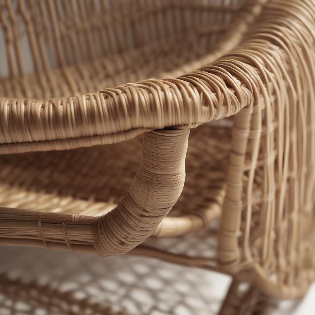 Detailed view of a rattan chair, emphasizing the craftsmanship of the woven joints and the natural texture