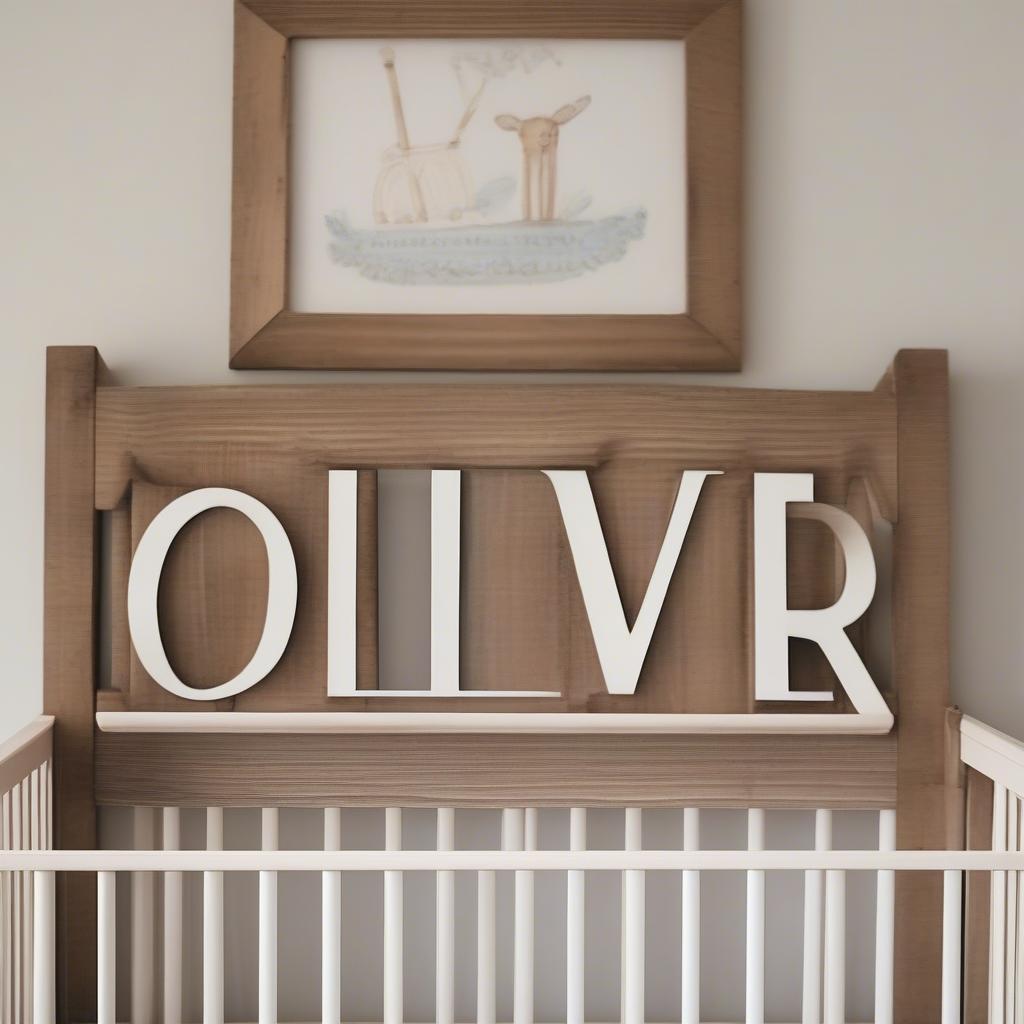 Rustic wood name sign hanging above a crib in a nursery