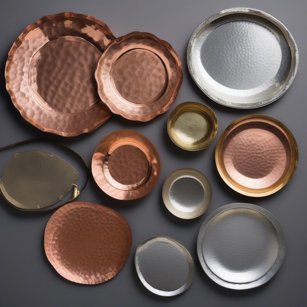 Different sizes and metal types of hammered trays